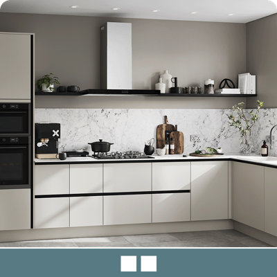 Explore the Stevia handleless gloss light grey kitchen, featuring high shine slab doors for easy cleaning.