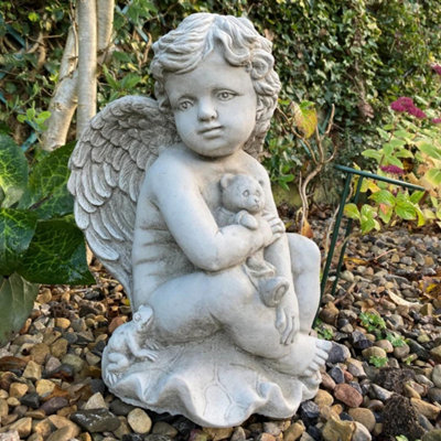 Stone Cast Cherub Ornament with Teddy on Hand