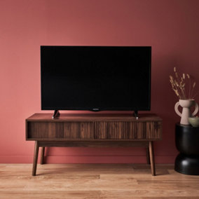 sweeek. 115cm TV unit grooved wood detail 2 doors Linear Dark wood colour 115x40x48 cm