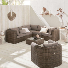 sweeek. 6-seater round rattan garden sofa set - 5-seater corner sofa 1 armchairs 1 coffee table - Tonico - Beige