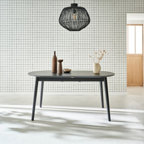 sweeek. 6 to 8-seater extendable oval dining table Lisa Black 160x90x75 cm