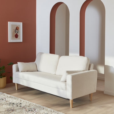 White couch deals with wooden legs