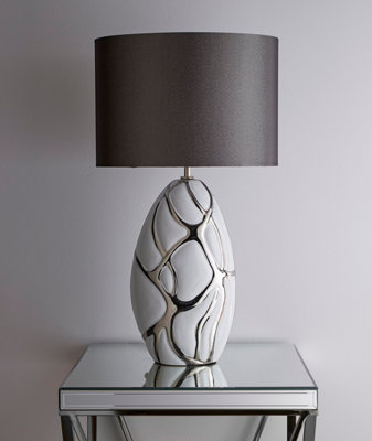 Tall white with silver Table lamp in a ceramic finish and dark grey lampshade pebble style base finish