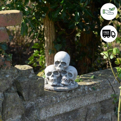 Three Skull Stone cast Garden Ornament