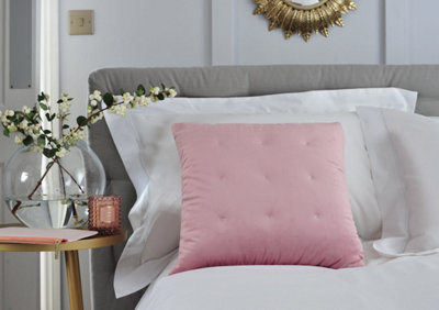 Pink bed shop throw and cushions