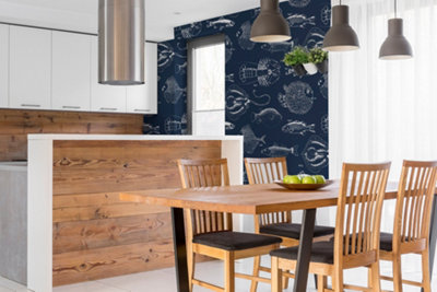Dark blue and white fish print wallpaper in a kitchen.