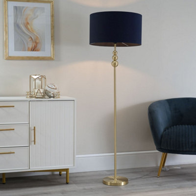 Navy shops and gold floor lamp