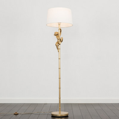 Gold monkey floor deals lamp