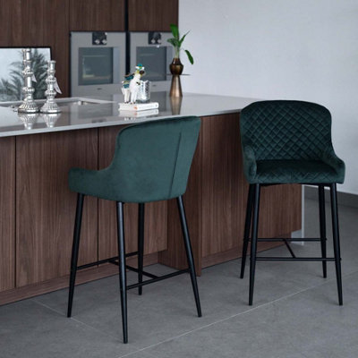 Velvet green bar stool with diamond stitch and black metal legs and
