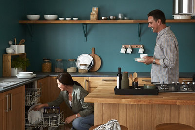 Designing a resource smart kitchen with a couple interacting in a kitchen.