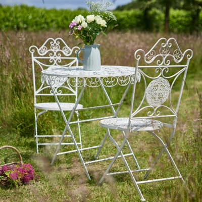 Cream metal 2024 garden table