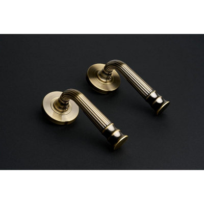 Whitby Lever on Large Rose Door Handle - Antique Brass - Pair - Designer Levers