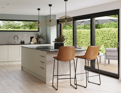 A large kitchen with a white kitchen island with a tiled base on one side.