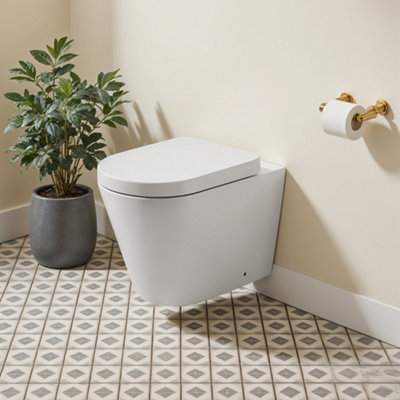 White Wall Mounted Elongated Toilet without flush