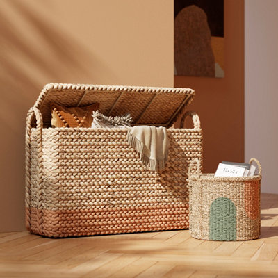 Wicker trunk with a painted wicker book holder.