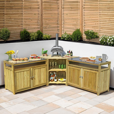 Light wood outdoor kitchen in a corner formation on a patio.