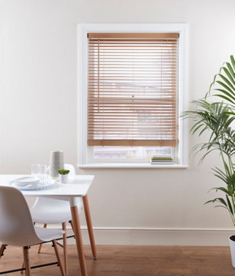 Wood venetian blinds in a dining room.