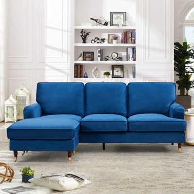 Woodbury 218cm Reversible Blue Velvet Fabric Corner Sofa Walnut Colour Legs with Brass Coloured Wheel