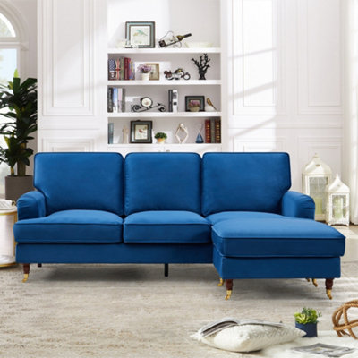 Woodbury 218cm Reversible Blue Velvet Fabric Corner Sofa Walnut Colour Legs with Brass Coloured Wheel