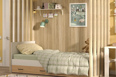 Single bed in a child's bedroom with vertical wooden panels on either side.
