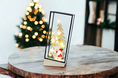 Xmas Haus Hurricane Glass Holder with Light Up Festive Village and Santa Scene Battery Operated