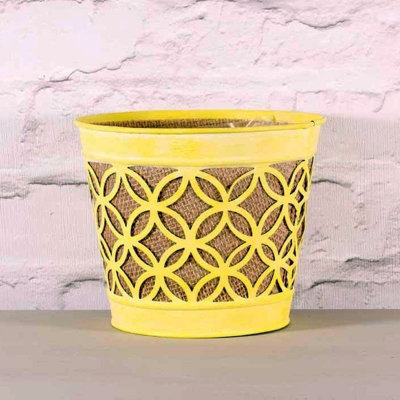 Yellow Detailed Fretwork Round Planter. Hessian Inner with a  Soft Plastic Liner. H16.5 cm.